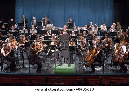 BUDAPEST - MARCH 6: Members of the MAV Symphonic Orchestra perform on stage at Thalia Theater on March 06, 2010 in Budapest, Hungary.