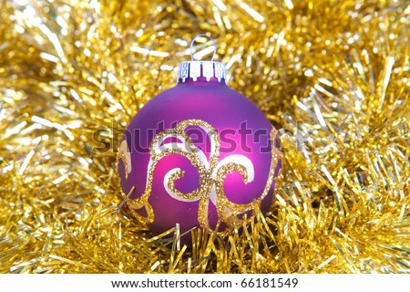 purple christmas ball in gold decorations