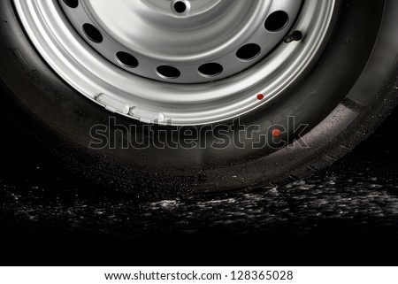 Car tire splashing in water, Tire with water.