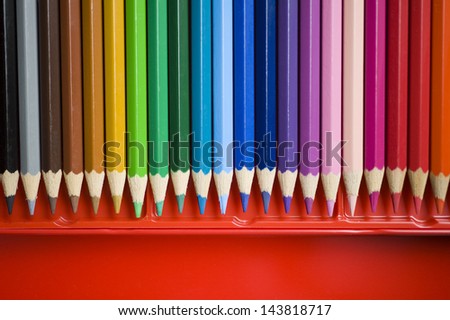 Color pencils in red box.