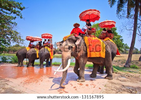 Ayutthaya, Thailand - March 7: Tourists On An Elephant Ride Tour Of The Ancient City On March 7, 2013 In Ayutthaya.