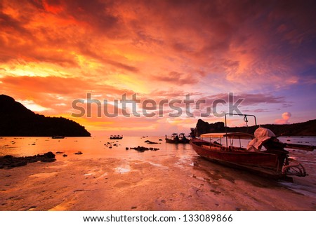 Ship Sea stones at sunset Phi Phi Island thailand