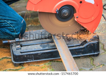 The worker cut steel and Worker cutting metal with grinder. Sparks while grinding iron