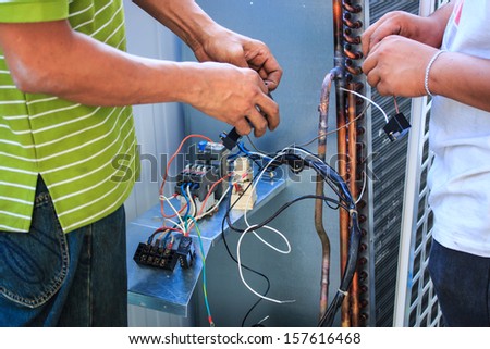 Technicians were repairing air-conditioning