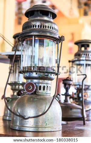 Lit hurricane lamps and lanterns or hurricane lamps