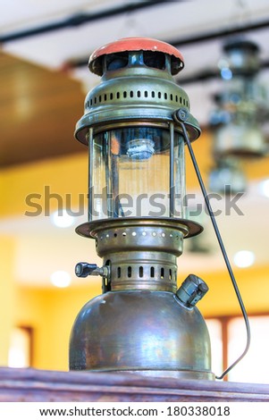 Lit hurricane lamps and lanterns or hurricane lamps