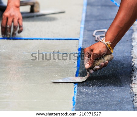 plasterer concrete worker smooth the cement