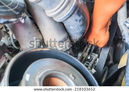 Engine mechanic working in auto repair shop