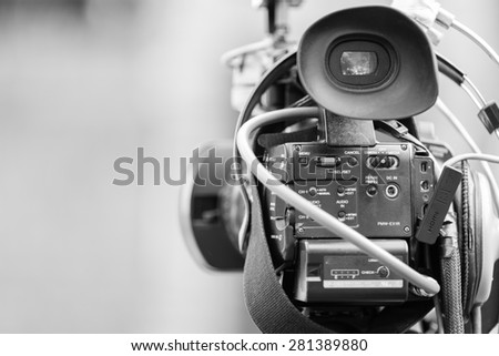 Video camera operator working with his professional equipment