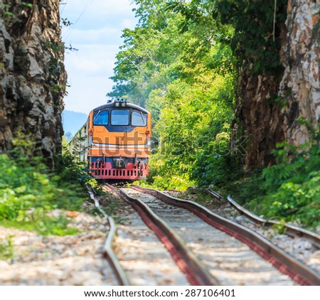 Train tours and train running  past tunnel  kanjanaburi,Thailand