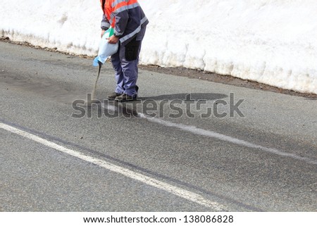 Road maintenance cleaning a Trace of oil in winter
