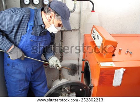 Man doing maintenance of a central heating system