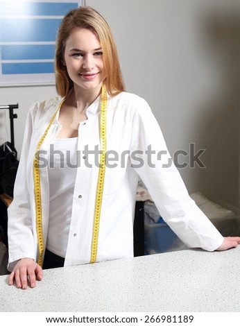 A Woman at a counter of a dry cleaning