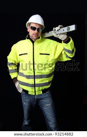 Building worker with level and glasses