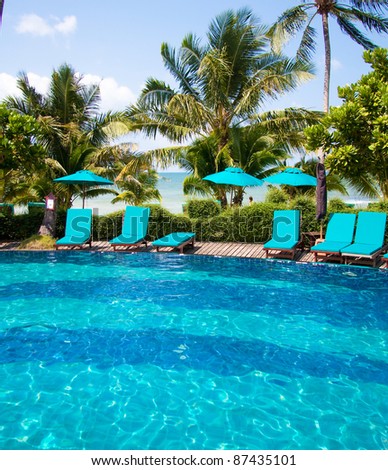 Cozy chairs near luxury pool