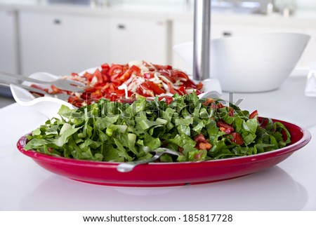 Buffet style salad in trays at restaurant. Fresh, healthy food.