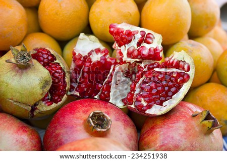 Fresh red garnet, pomegranate closeup, background, wallpaper. Slice of garnet, pomegranate. Garnet, pomegranate on market for sale