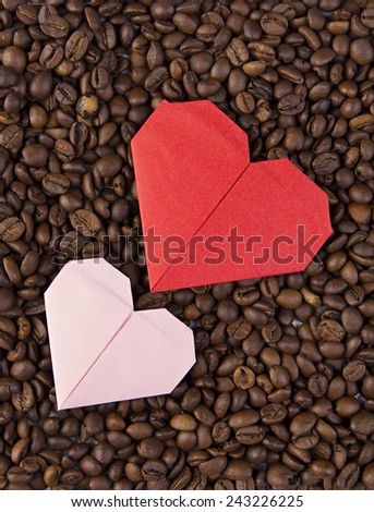 Valentine\'s day, wedding, love, Red, pink heart, paper heart .Red paper heart on background of coffee beans. Textures of roasted coffee bean with red heart for background.