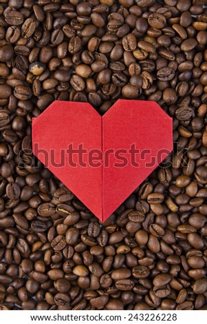 Valentine's day, wedding, love, Red heart, paper heart .Red paper heart on background of coffee beans. Textures of roasted coffee bean with red heart for background.