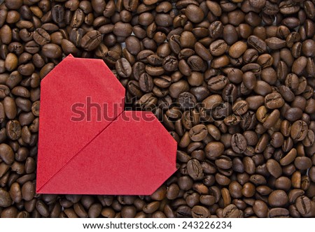 Valentine\'s day, wedding, love, Red heart, paper heart .Red paper heart on background of coffee beans. Textures of roasted coffee bean with red heart for background.