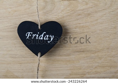 Black heart on wooden background. Valentine's Day, love, heart, feelings, gift, wedding, holiday, black Friday