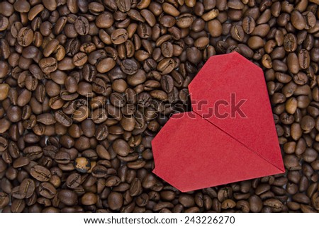 Valentine\'s day, wedding, love, Red heart, paper heart .Red paper heart on background of coffee beans. Textures of roasted coffee bean with red heart for background.