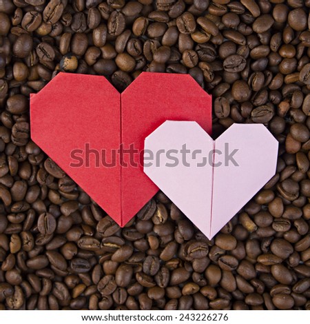 Valentine\'s day, wedding, love, Red, pink heart, paper heart .Red paper heart on background of coffee beans. Textures of roasted coffee bean with red heart for background.