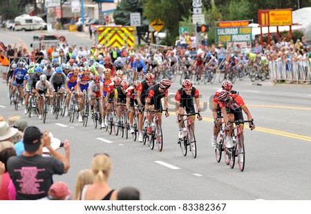 BUENA VISTA, CO - AUG. 24: Levi Leipheimer (yellow jersey) jockeys for position in a pack of cyclists in the stage-2 portion of the Peloton during the US Pro Cycling Challenge on Aug. 24, 2011 in Buena Vista, Colorado. The bikers summit two peaks over 12,