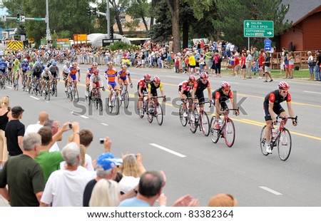 BUENA VISTA, CO - AUG. 24: Levi Leipheimer (yellow jersey) and a pack of cyclists take the lead in the stage-3 portion of the Peloton during the US Pro Cycling Challenge on Aug. 24, 2011 in Buena Vista, Colorado. The bikers summit two peaks over 12,000 fe