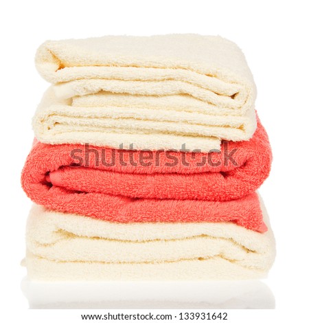 Pile of the bathing towels, isolated on white
