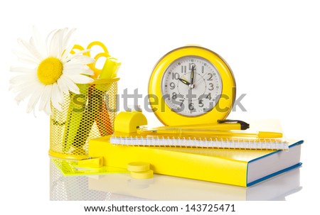 Set of school deliveries, hours, writing-book and the book isolated on white