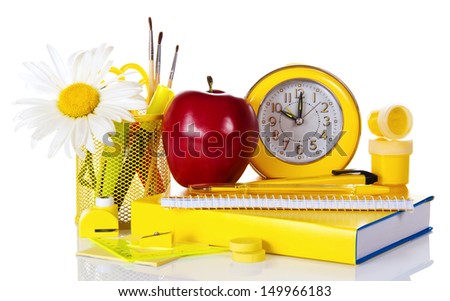 Set of school deliveries, big red apple, hours and the book, isolated on white