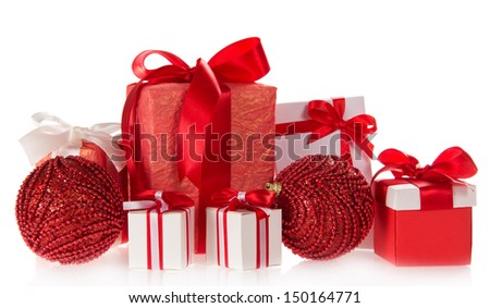 Gift boxes with tapes and bows, the spheres decorated with beads, isolated on white
