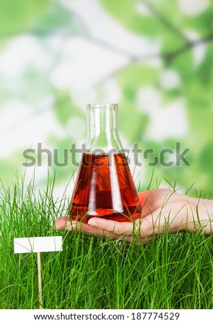 Tall grass green watered red liquid outdoor