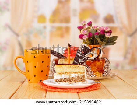 Cake and tea with flowers bouquet on table