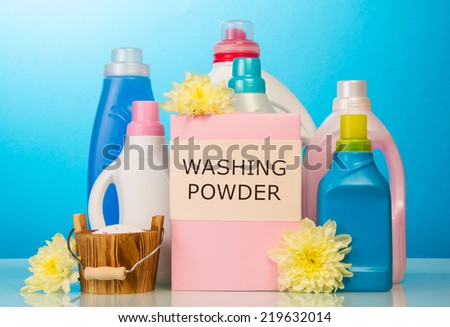 Washing powder and Cleaning items on blue background