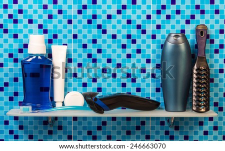 Electric shaver and lotion with deodorant in bathroom