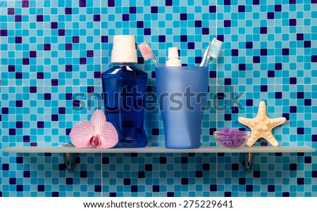 Bath accessories on blue background