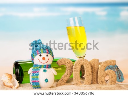 New year sign with champagne, snowman on the beach background