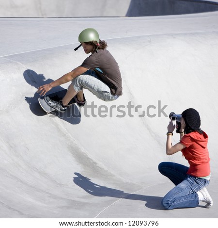 Boy dies tricks at the skateboard park as girl videotapes