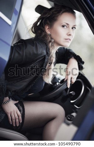 Woman in a sports car