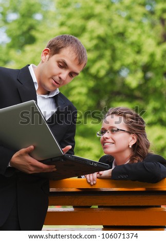 Young business people with laptop