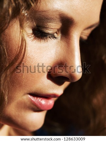 Portrait of sad beautiful woman looking down