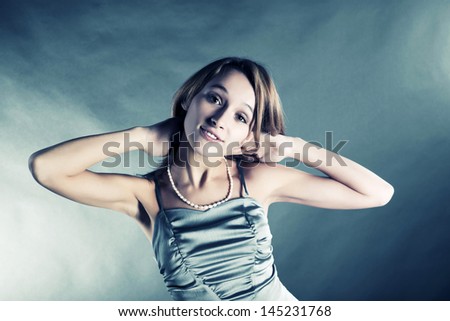Happy young woman in lilac dress