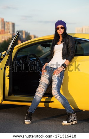 Fashionable Punk Woman Standing At The Car
