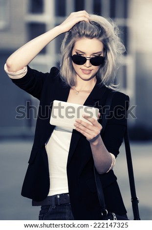 Young fashion business woman using tablet computer