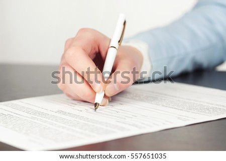 Business woman signing contract at office