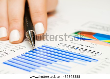 Female hand monitoring the stock index.