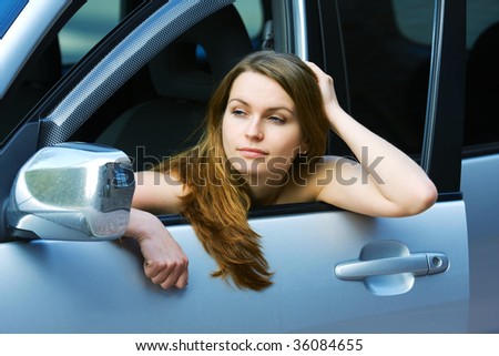 Young woman relaxing in the car.