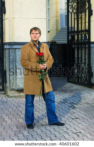 Young man with a roses.